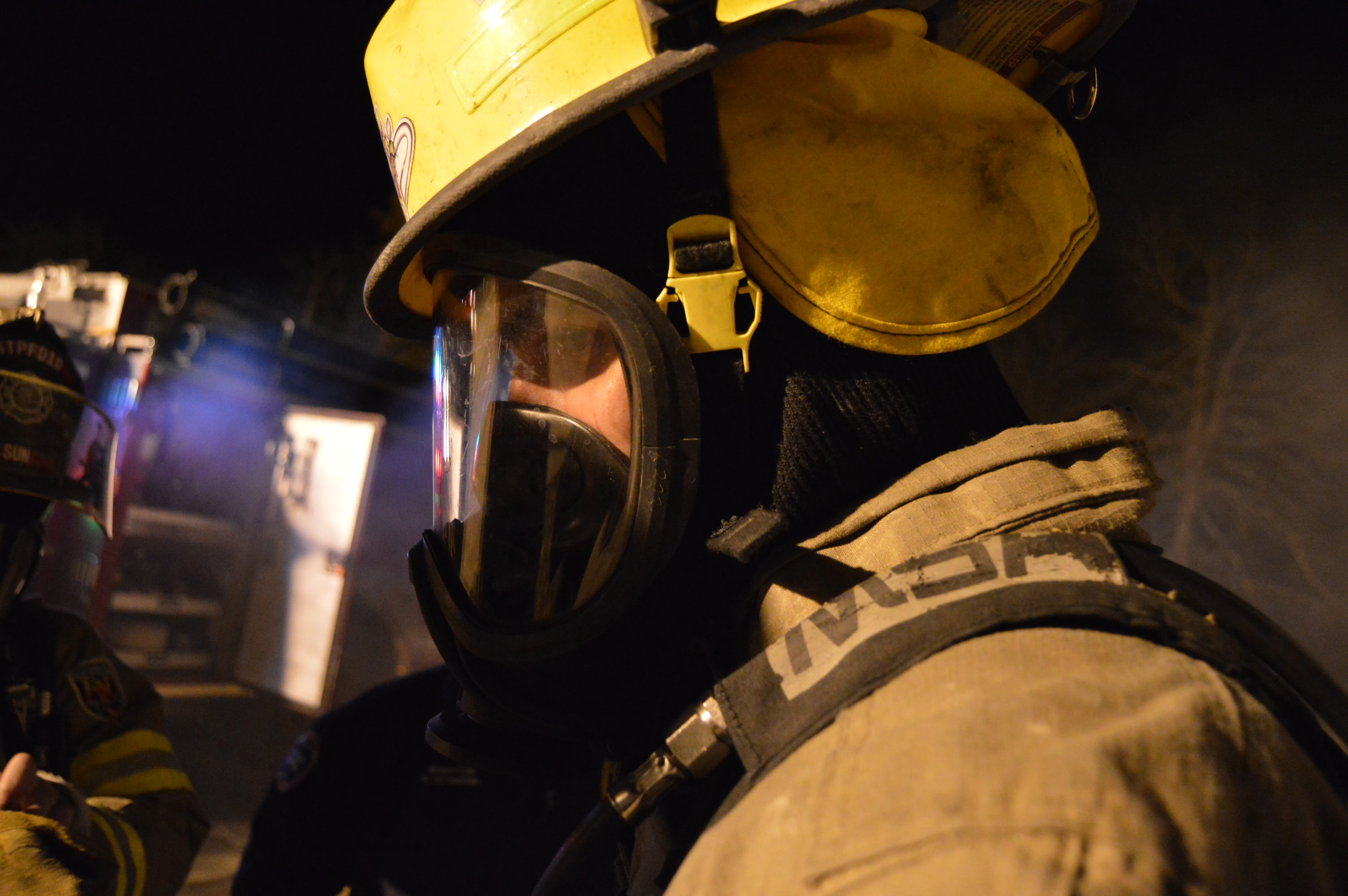 Firefighter in SCBA mask during training burn