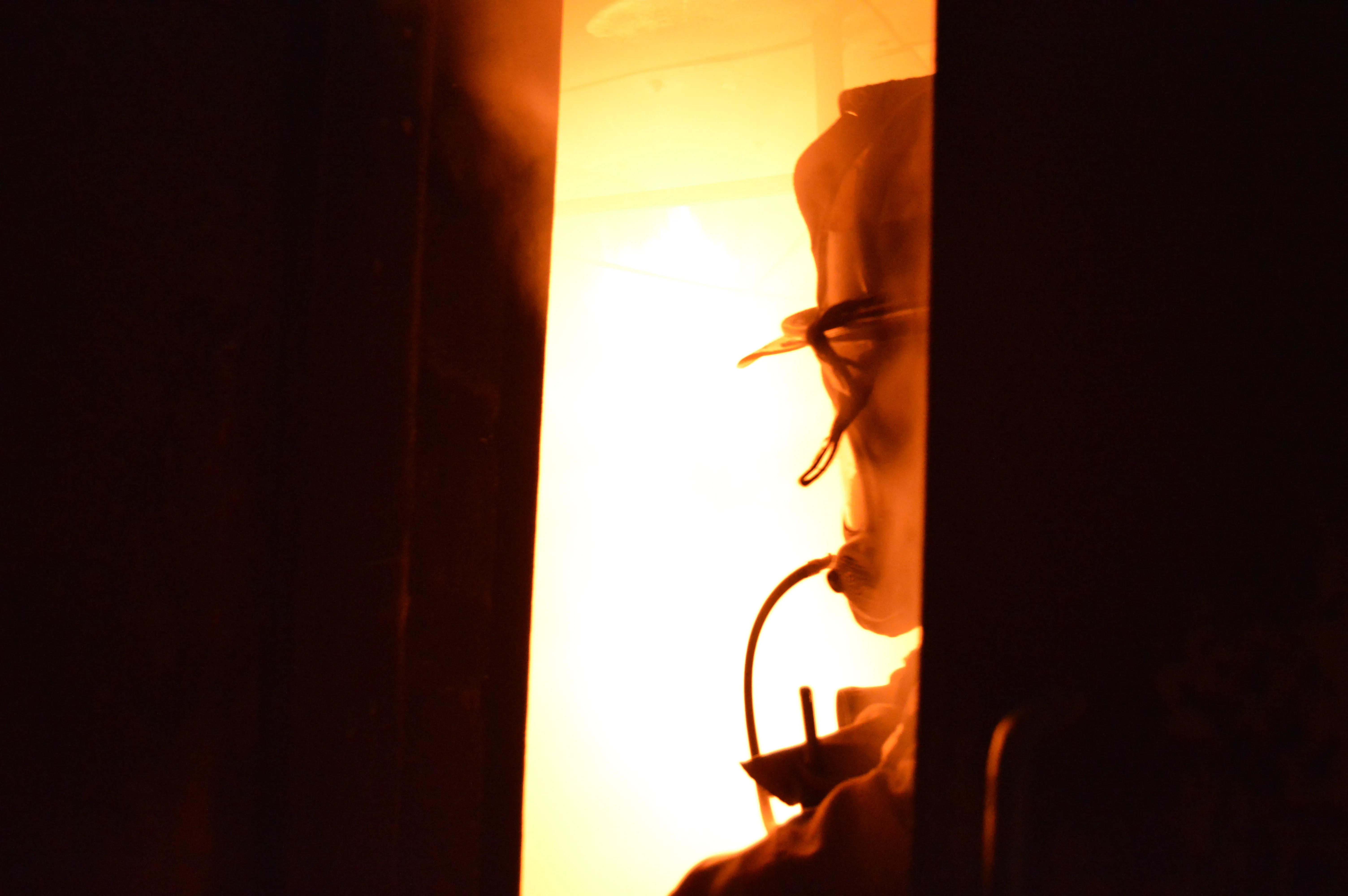 Fire visible through doorway during training